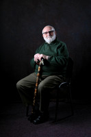older male "low key" "studio portrait" "black background"
